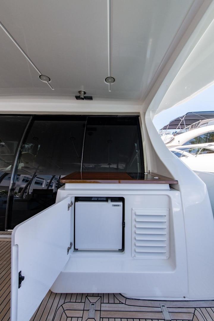 a white boat with a window aboard SOMEWHERE I BELONG Yacht for Sale