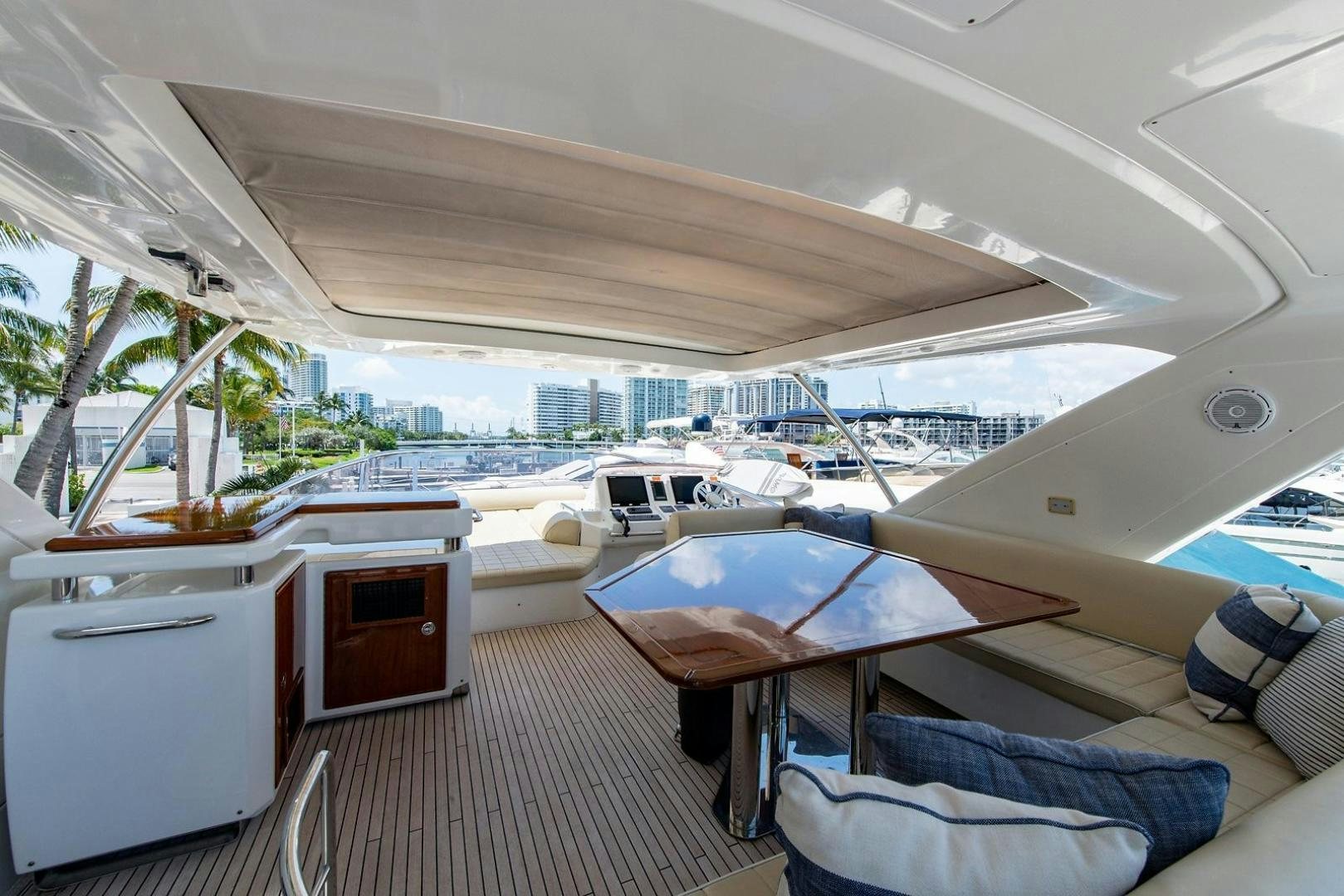 a room with a table and chairs aboard SOMEWHERE I BELONG Yacht for Sale