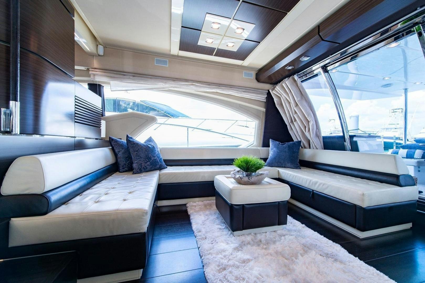 a room with a couch and a table aboard SOMEWHERE I BELONG Yacht for Sale