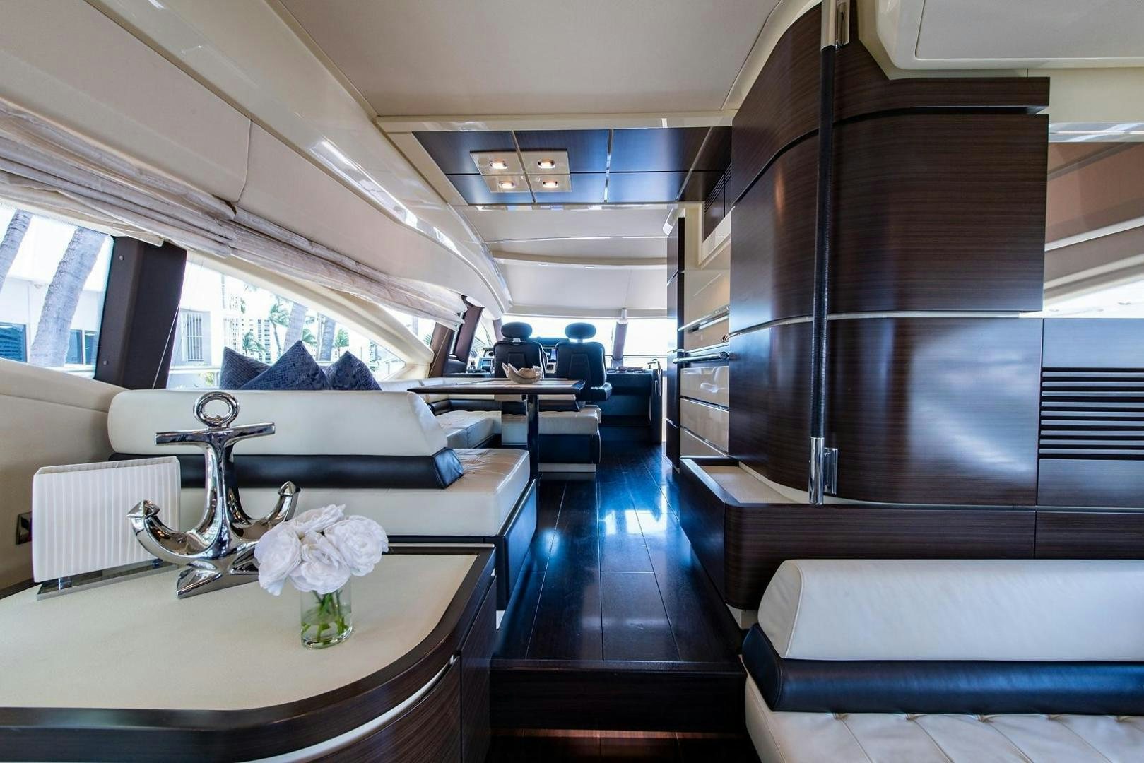 a room with a table and chairs aboard SOMEWHERE I BELONG Yacht for Sale