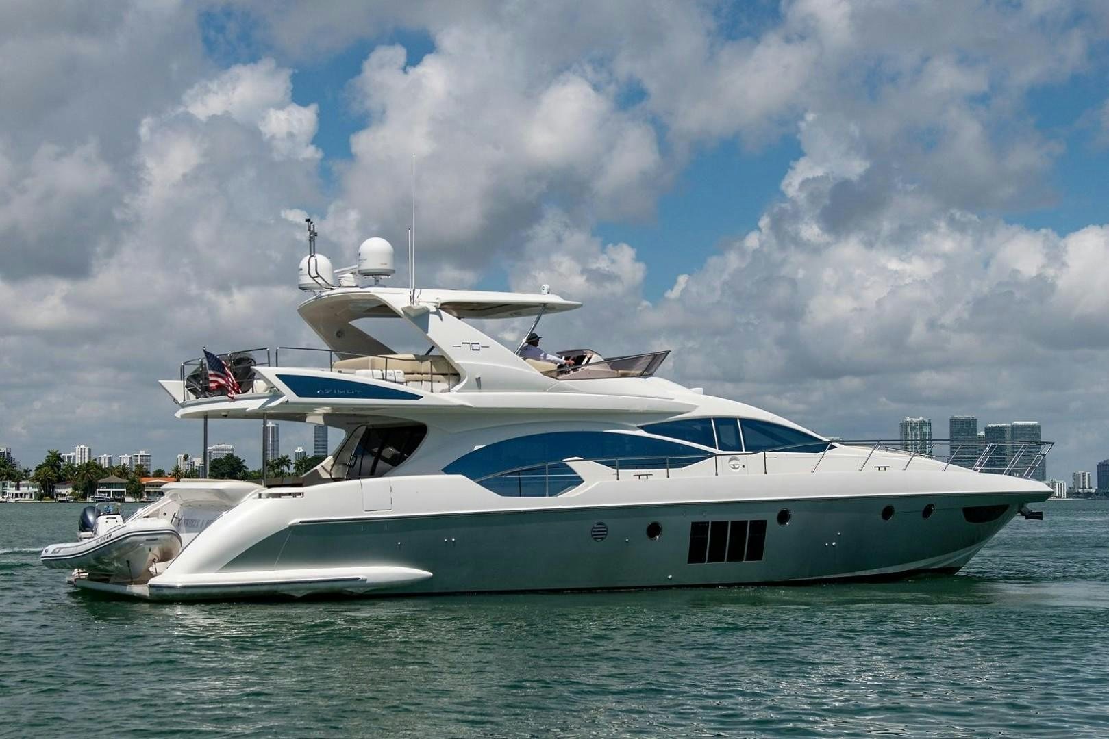 a white yacht in the water aboard SOMEWHERE I BELONG Yacht for Sale