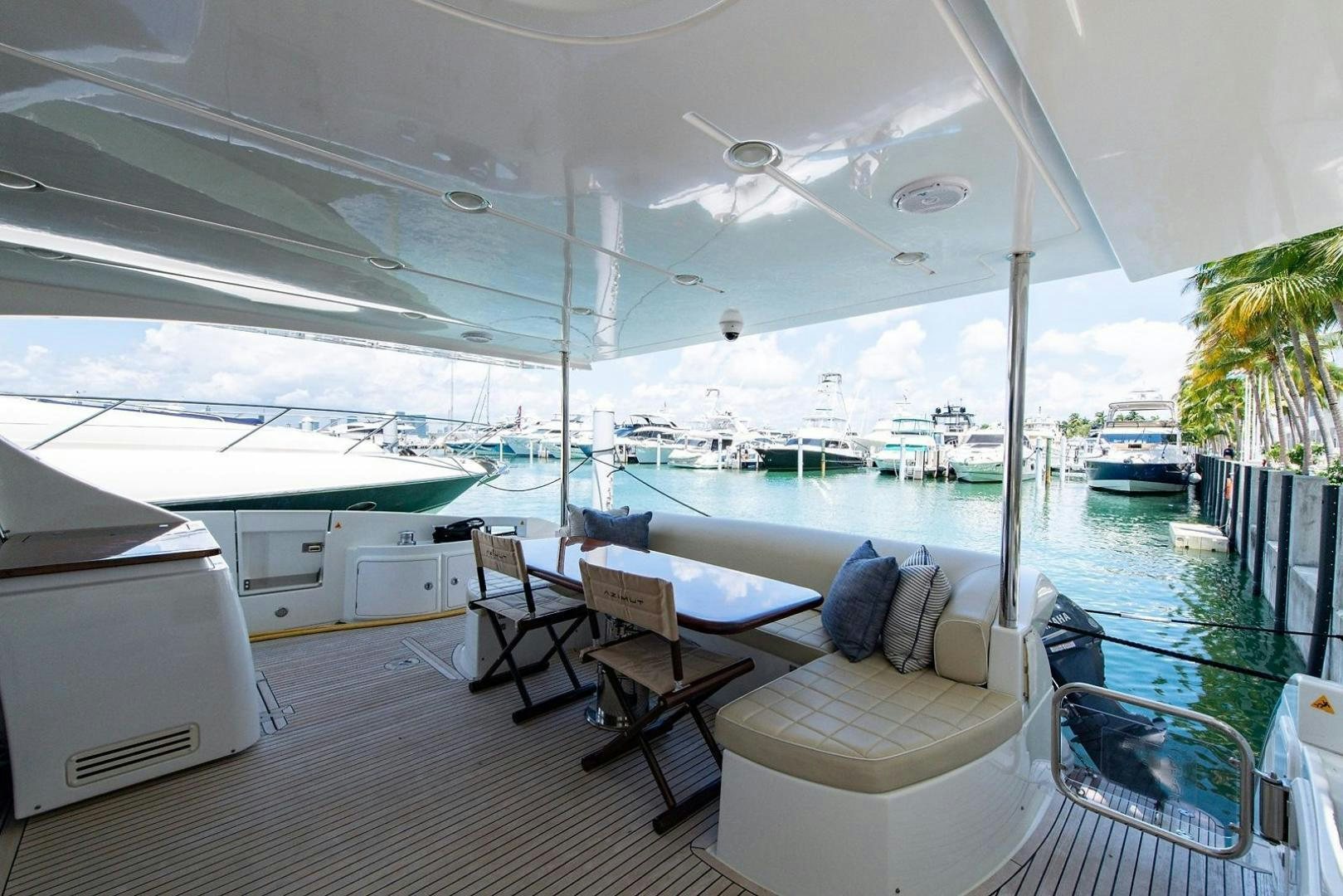 a room with a view of the water and the deck aboard SOMEWHERE I BELONG Yacht for Sale