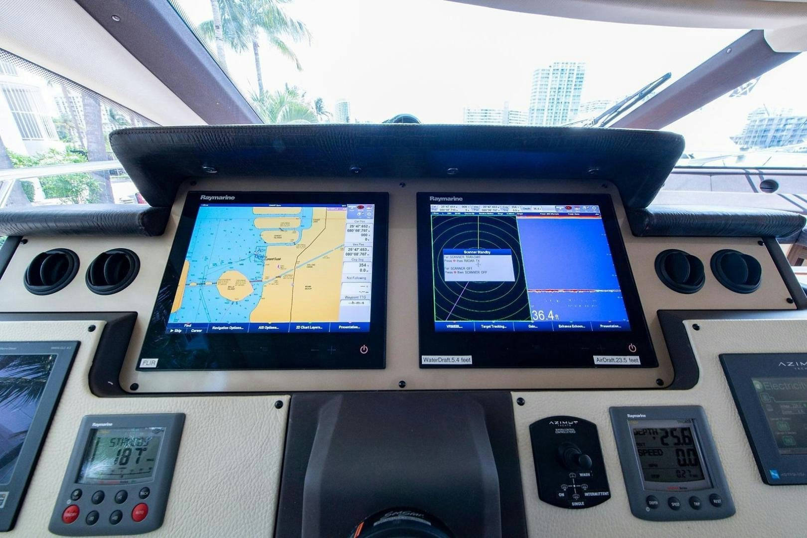 a console with a screen and a game on it aboard SOMEWHERE I BELONG Yacht for Sale