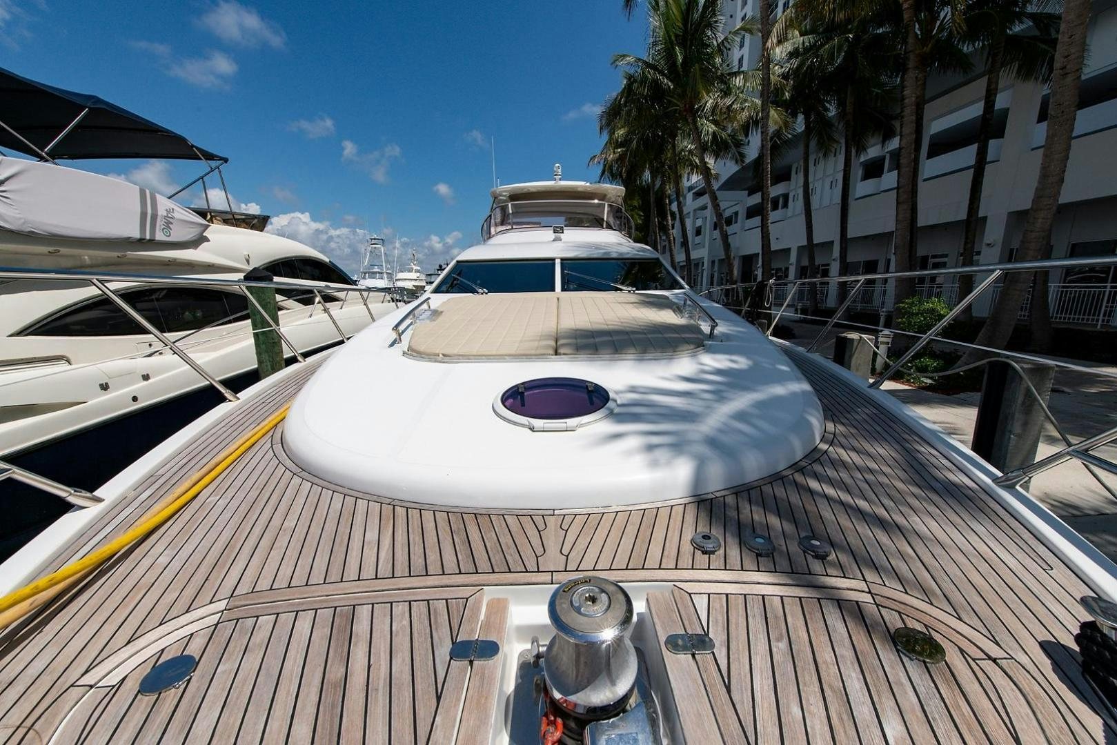 a boat on a deck aboard SOMEWHERE I BELONG Yacht for Sale
