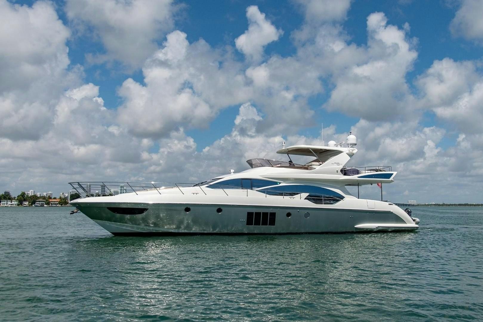 a white boat on the water aboard SOMEWHERE I BELONG Yacht for Sale