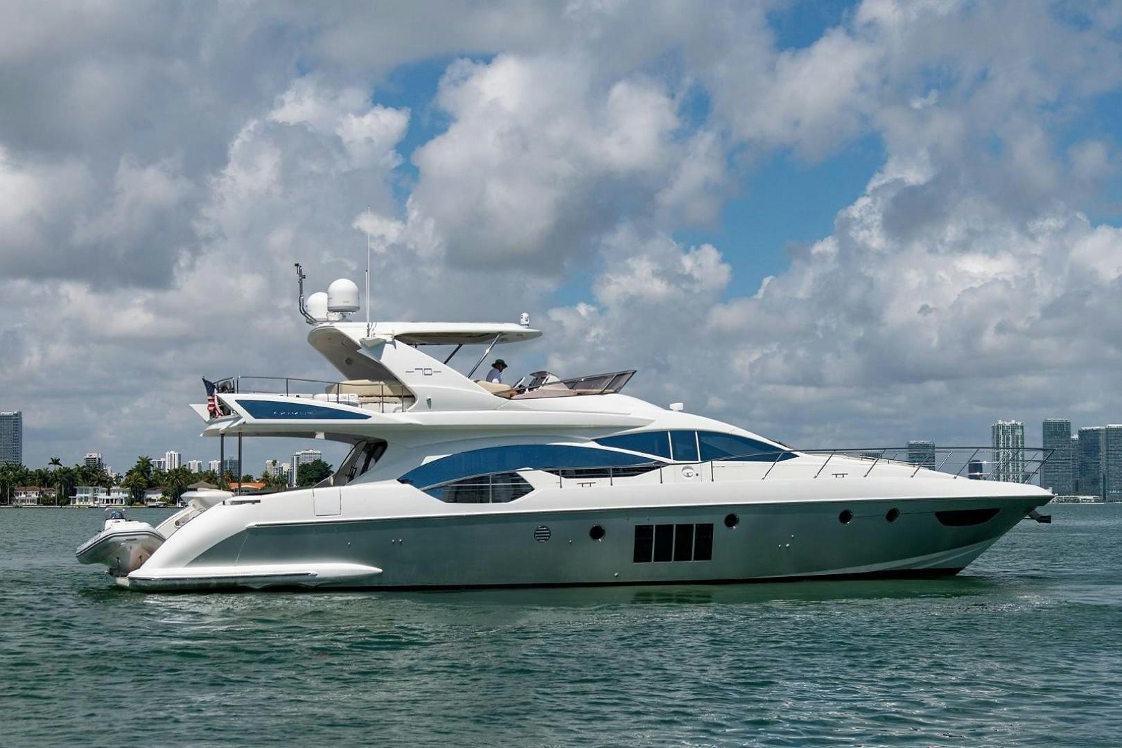 a white yacht in the water aboard SOMEWHERE I BELONG Yacht for Sale