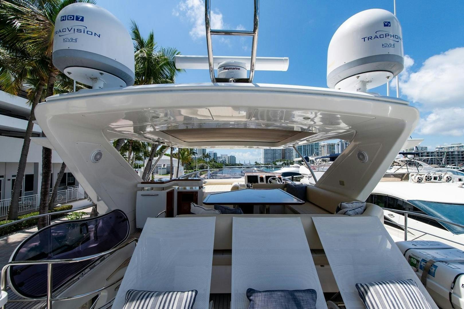 a couple of white boats on a dock aboard SOMEWHERE I BELONG Yacht for Sale