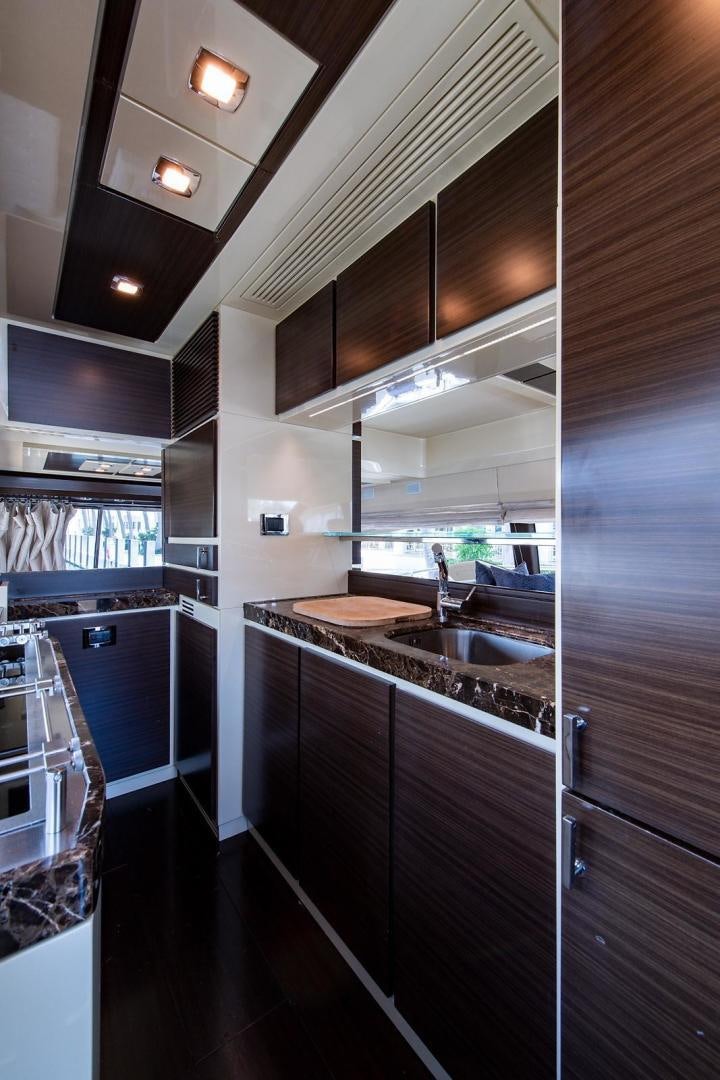 a kitchen with a large sink aboard SOMEWHERE I BELONG Yacht for Sale