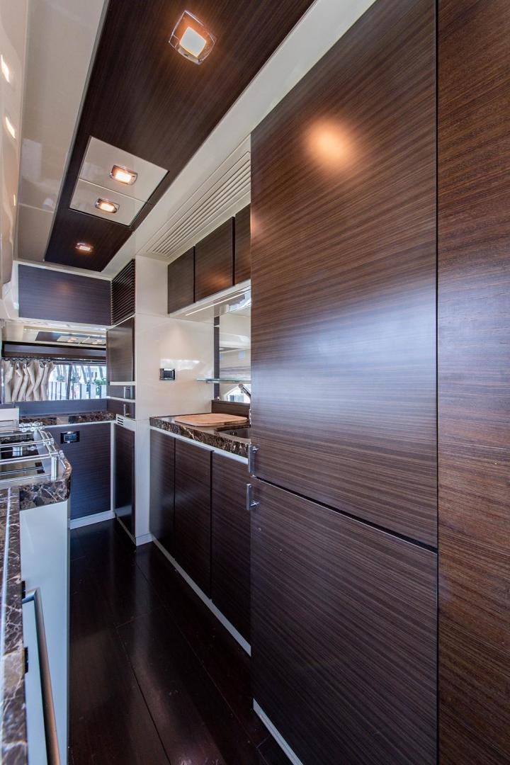 a kitchen with stainless steel appliances aboard SOMEWHERE I BELONG Yacht for Sale