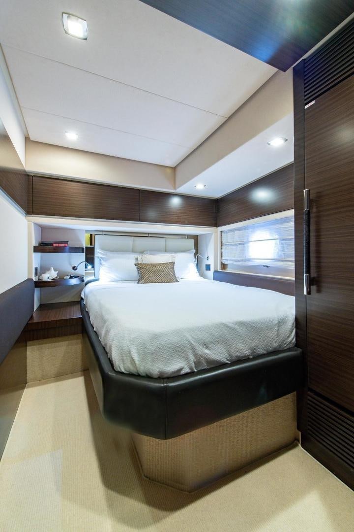 a bed in a room aboard SOMEWHERE I BELONG Yacht for Sale