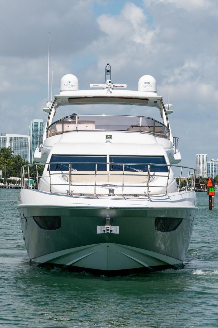 a large white boat in the water aboard SOMEWHERE I BELONG Yacht for Sale