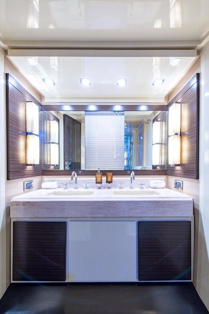 a bathroom with a sink and cabinets aboard SOMEWHERE I BELONG Yacht for Sale