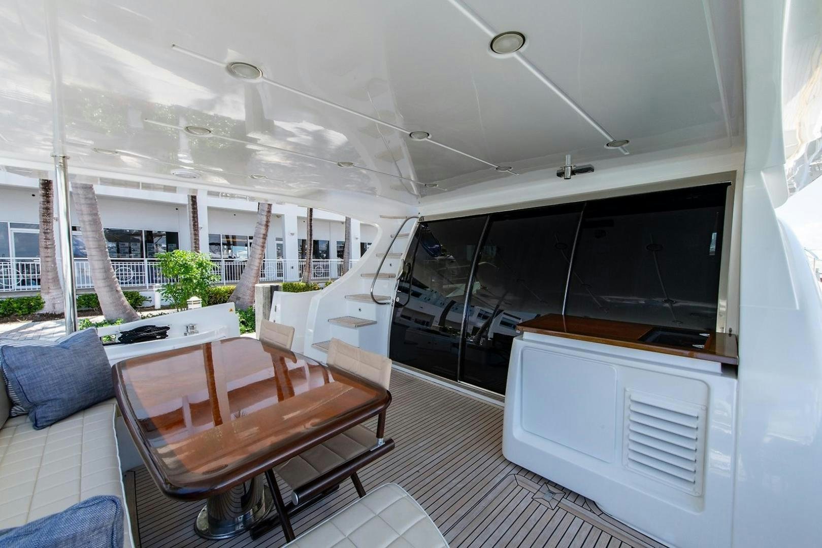 a room with a table and chairs aboard SOMEWHERE I BELONG Yacht for Sale