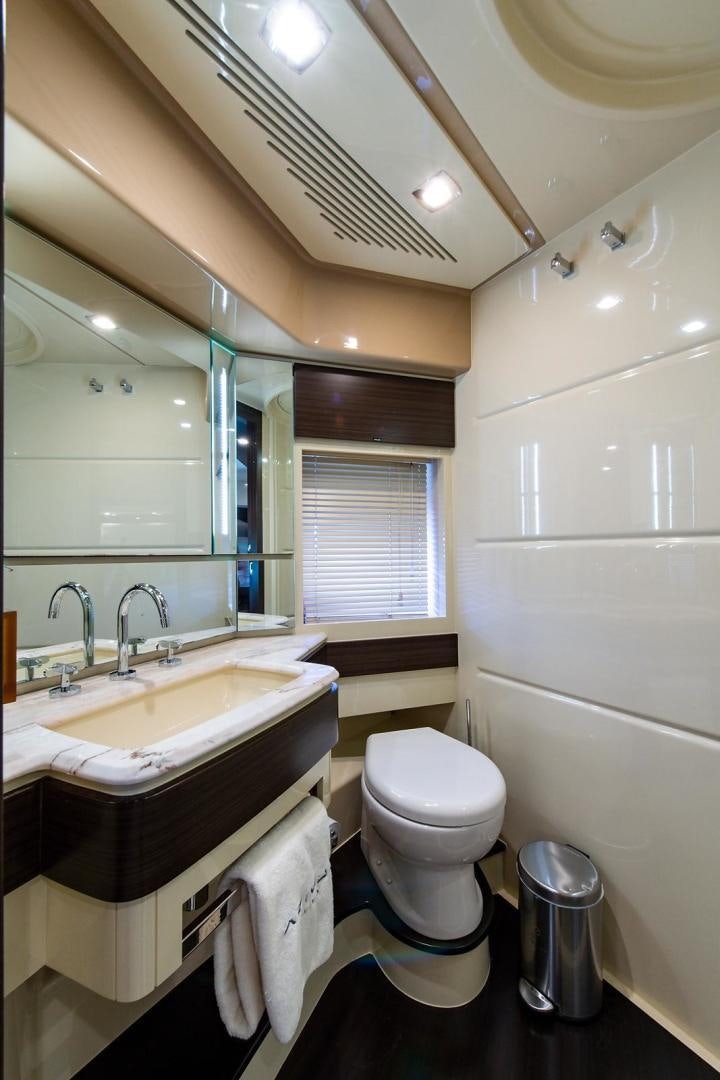 a bathroom with a toilet and sink aboard SOMEWHERE I BELONG Yacht for Sale