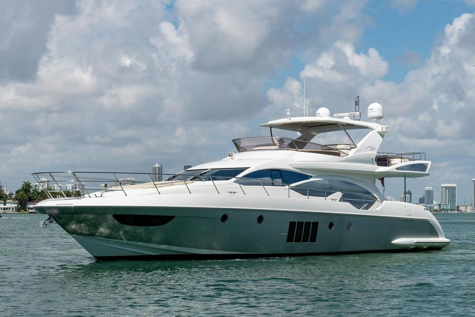 a white yacht in the water aboard SOMEWHERE I BELONG Yacht for Sale