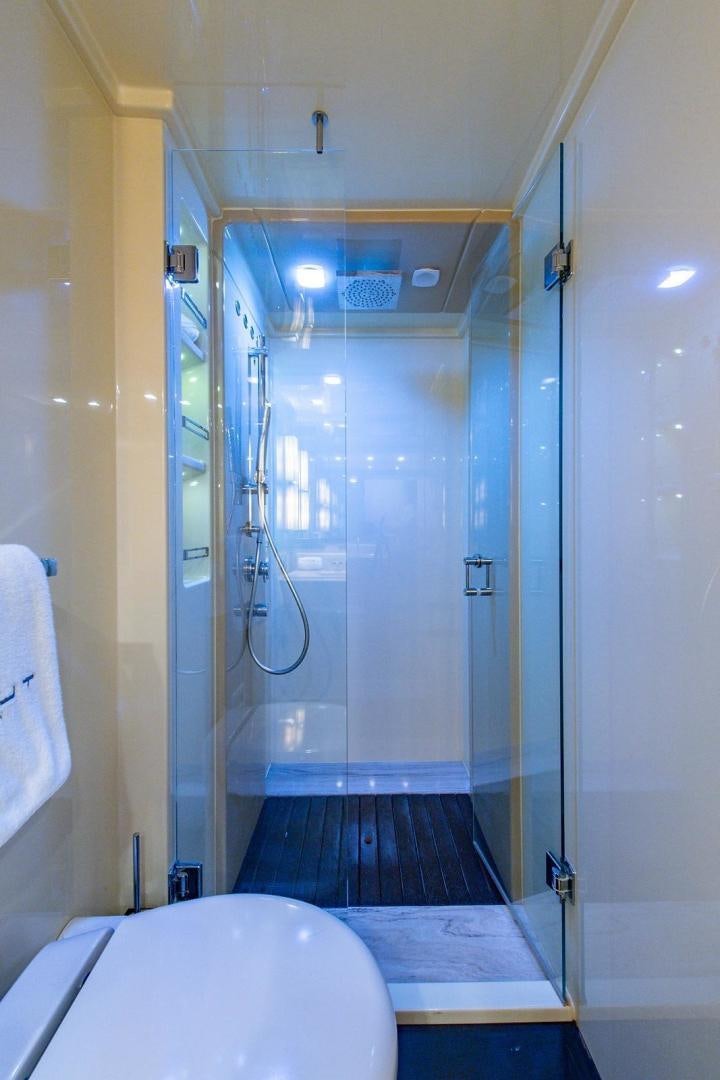 a bathroom with a shower and sink aboard SOMEWHERE I BELONG Yacht for Sale