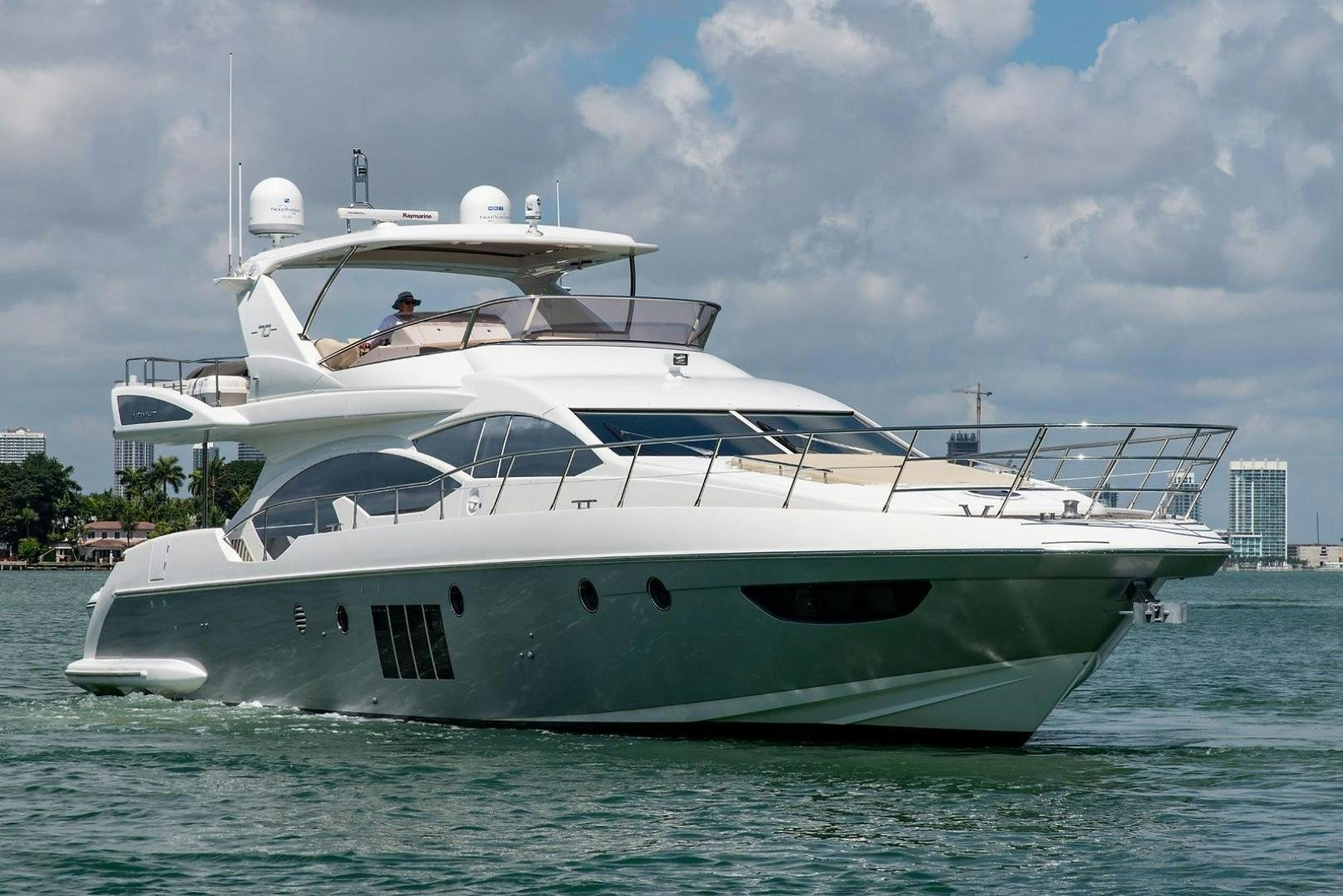 a white yacht in the water aboard SOMEWHERE I BELONG Yacht for Sale