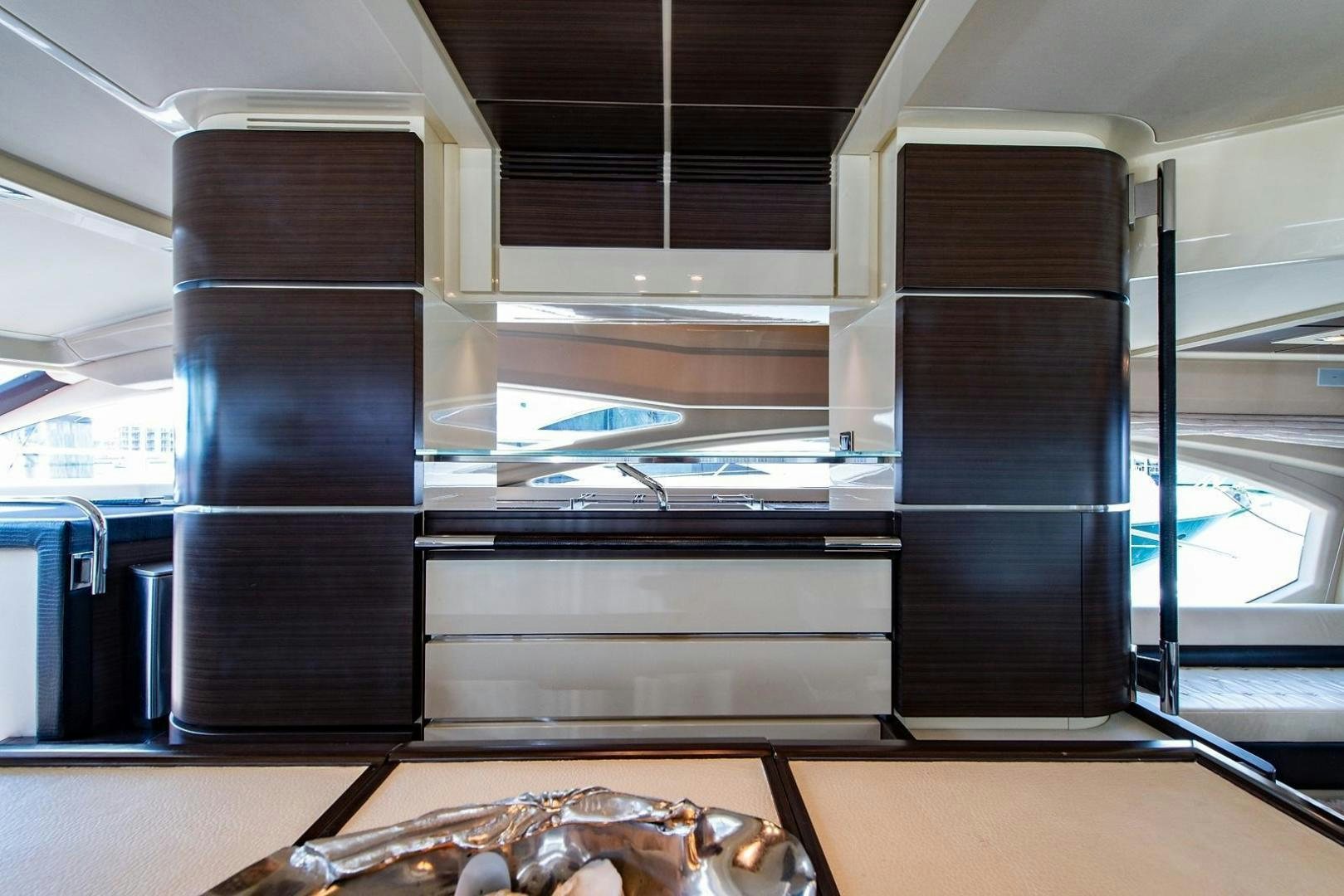 a large metal cabinet with a metal rack aboard SOMEWHERE I BELONG Yacht for Sale