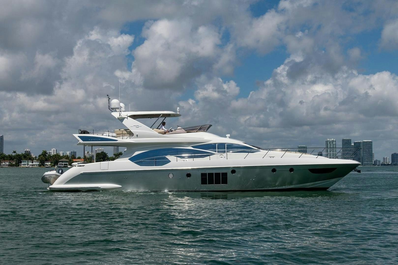 a white yacht in the water aboard SOMEWHERE I BELONG Yacht for Sale