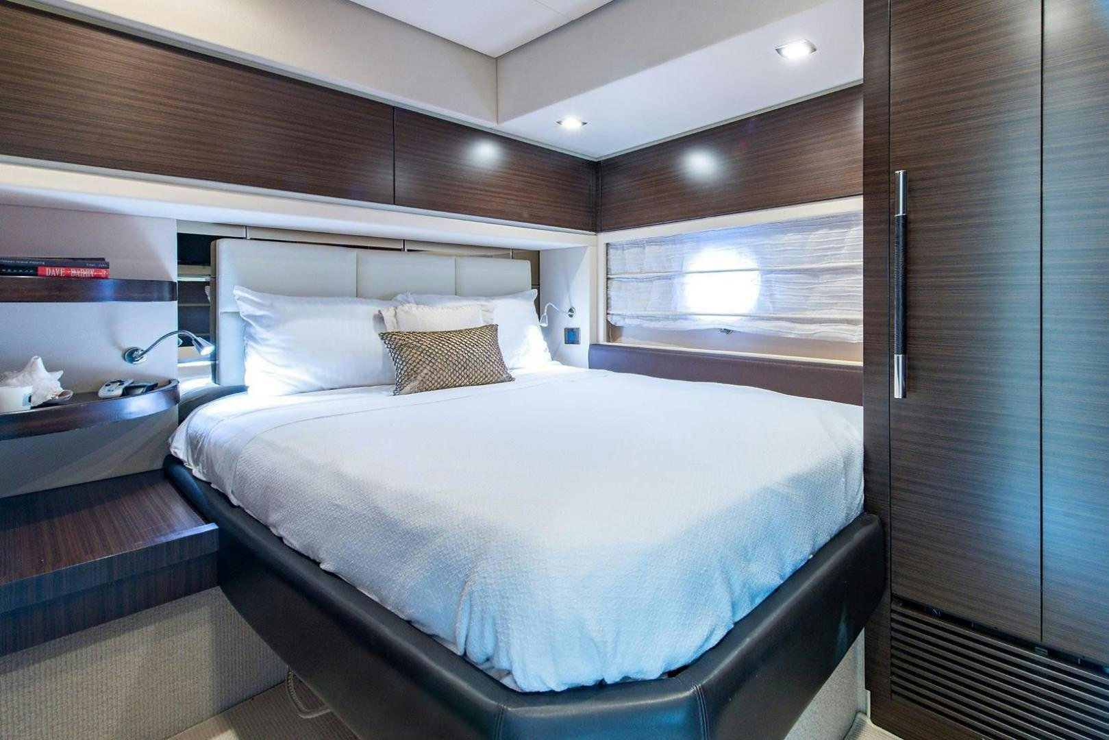 a bed with a white comforter aboard SOMEWHERE I BELONG Yacht for Sale