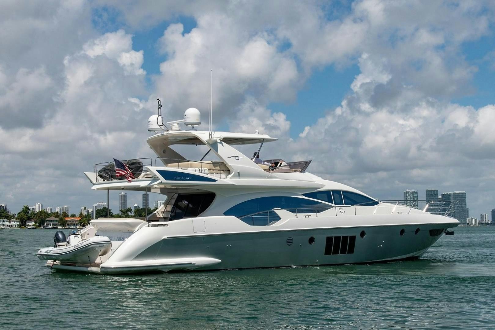 a large white boat in the water aboard SOMEWHERE I BELONG Yacht for Sale