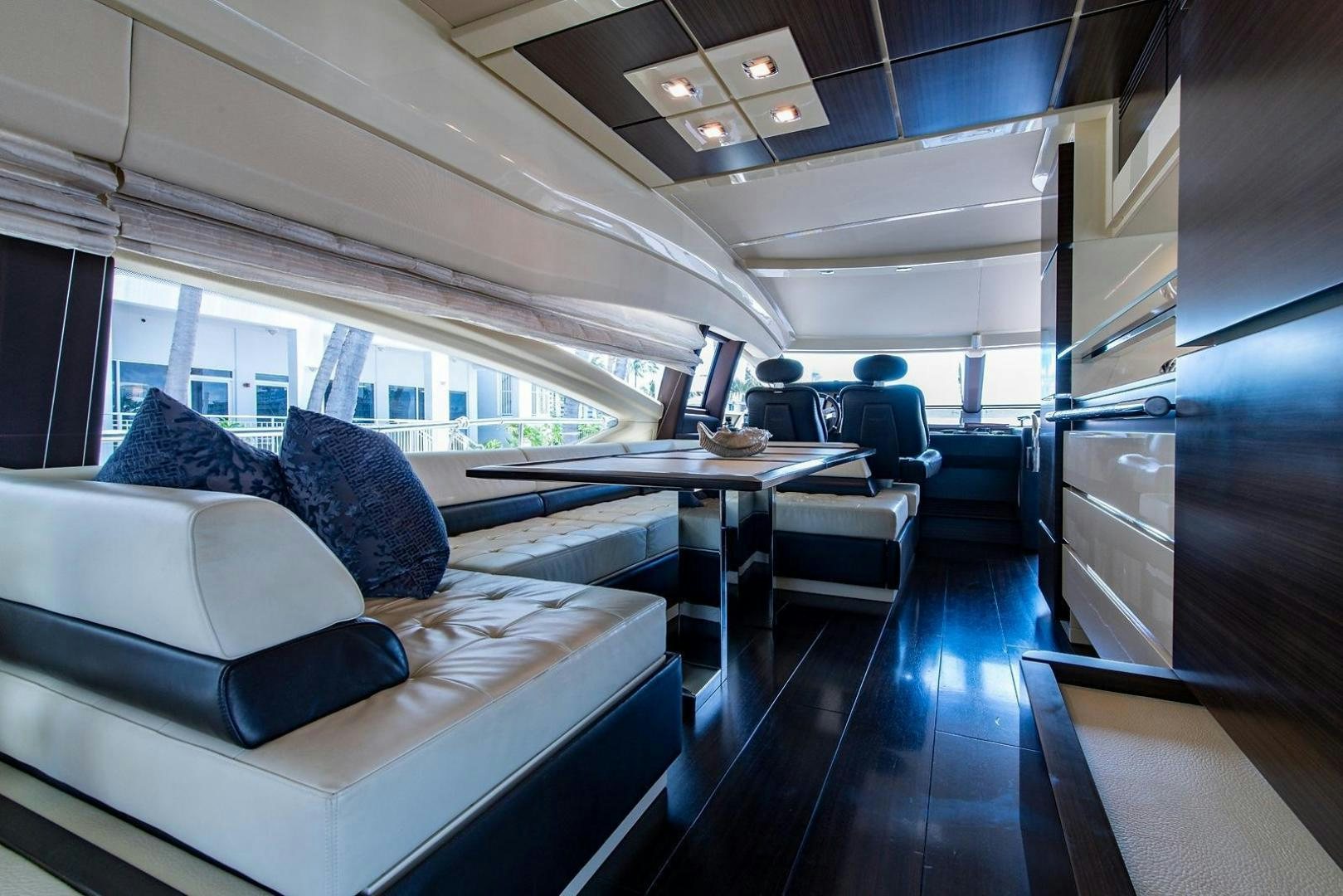 a room with a couch and a table aboard SOMEWHERE I BELONG Yacht for Sale