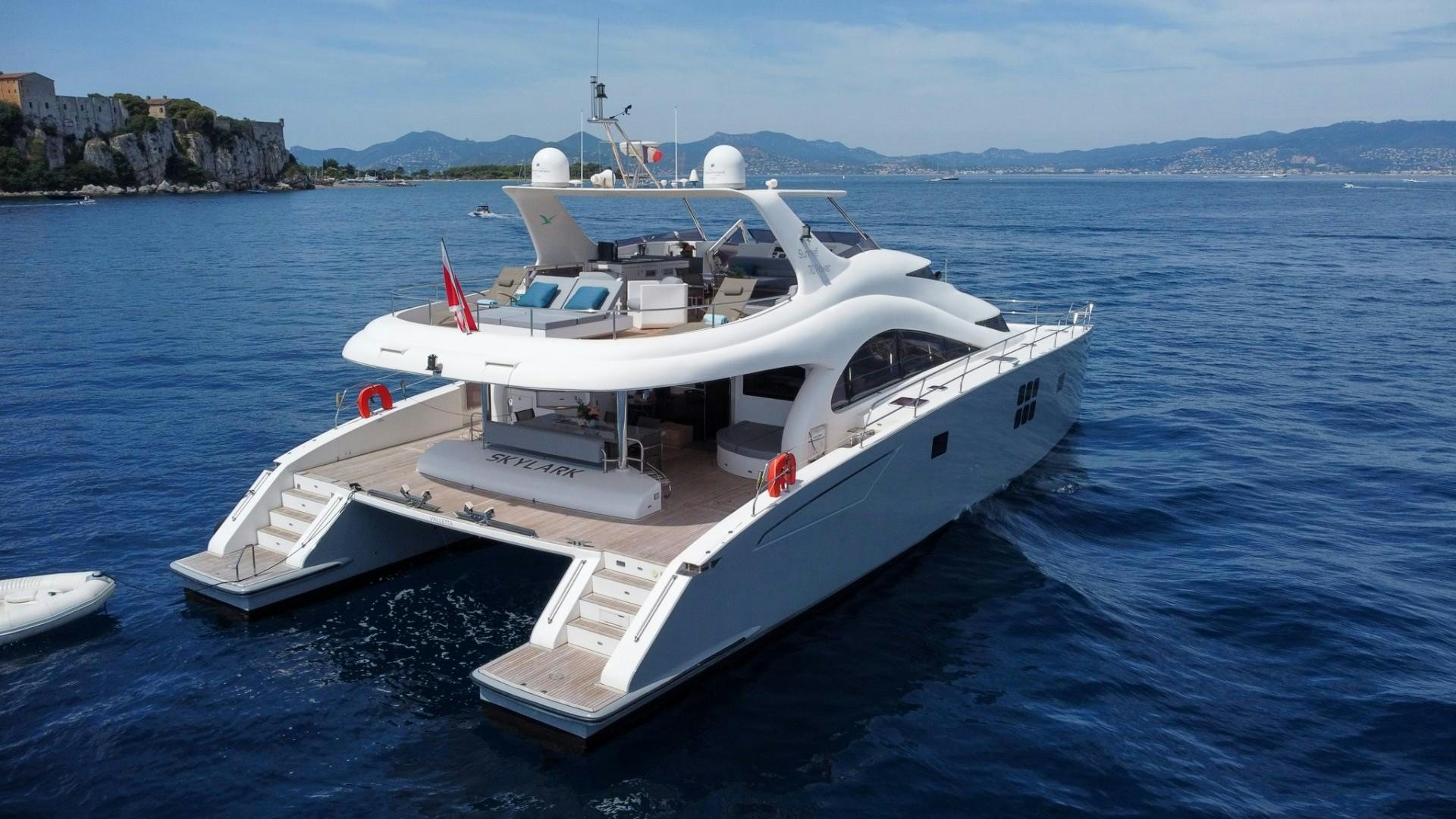 a white boat in the water aboard SKYLARK Yacht for Sale
