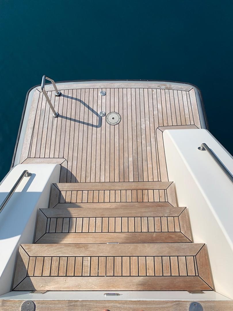 a staircase with a metal railing aboard SKYLARK Yacht for Sale