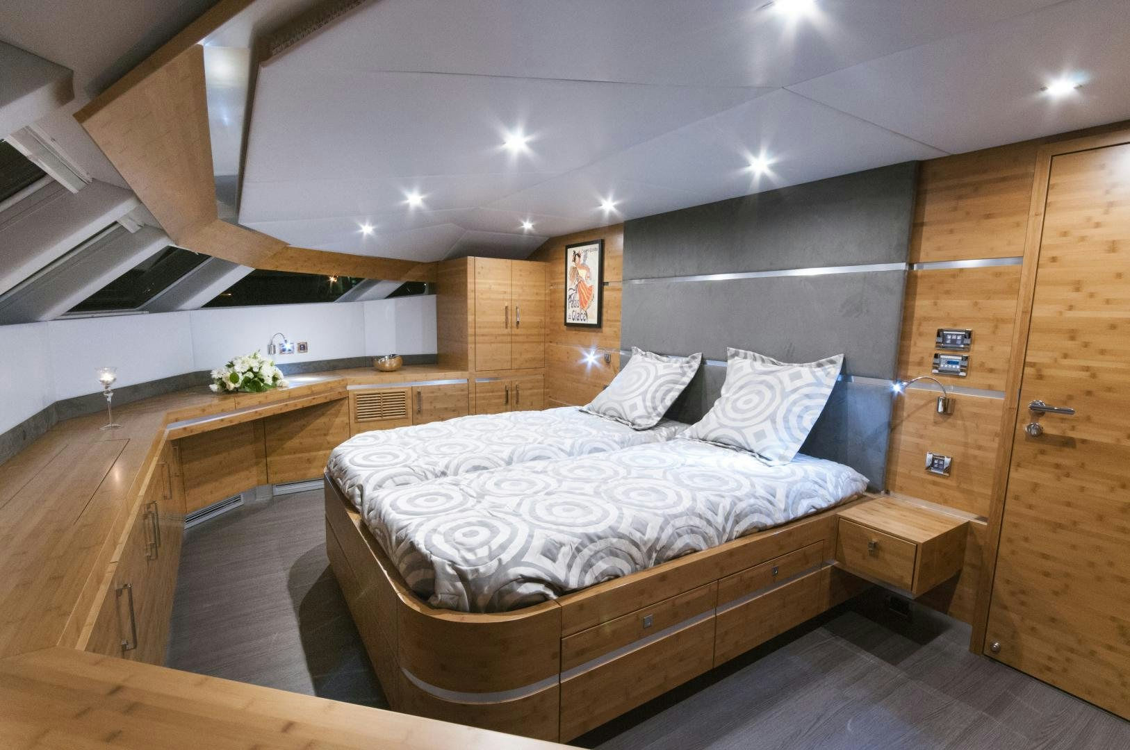 a room with a bed and a desk aboard SKYLARK Yacht for Sale