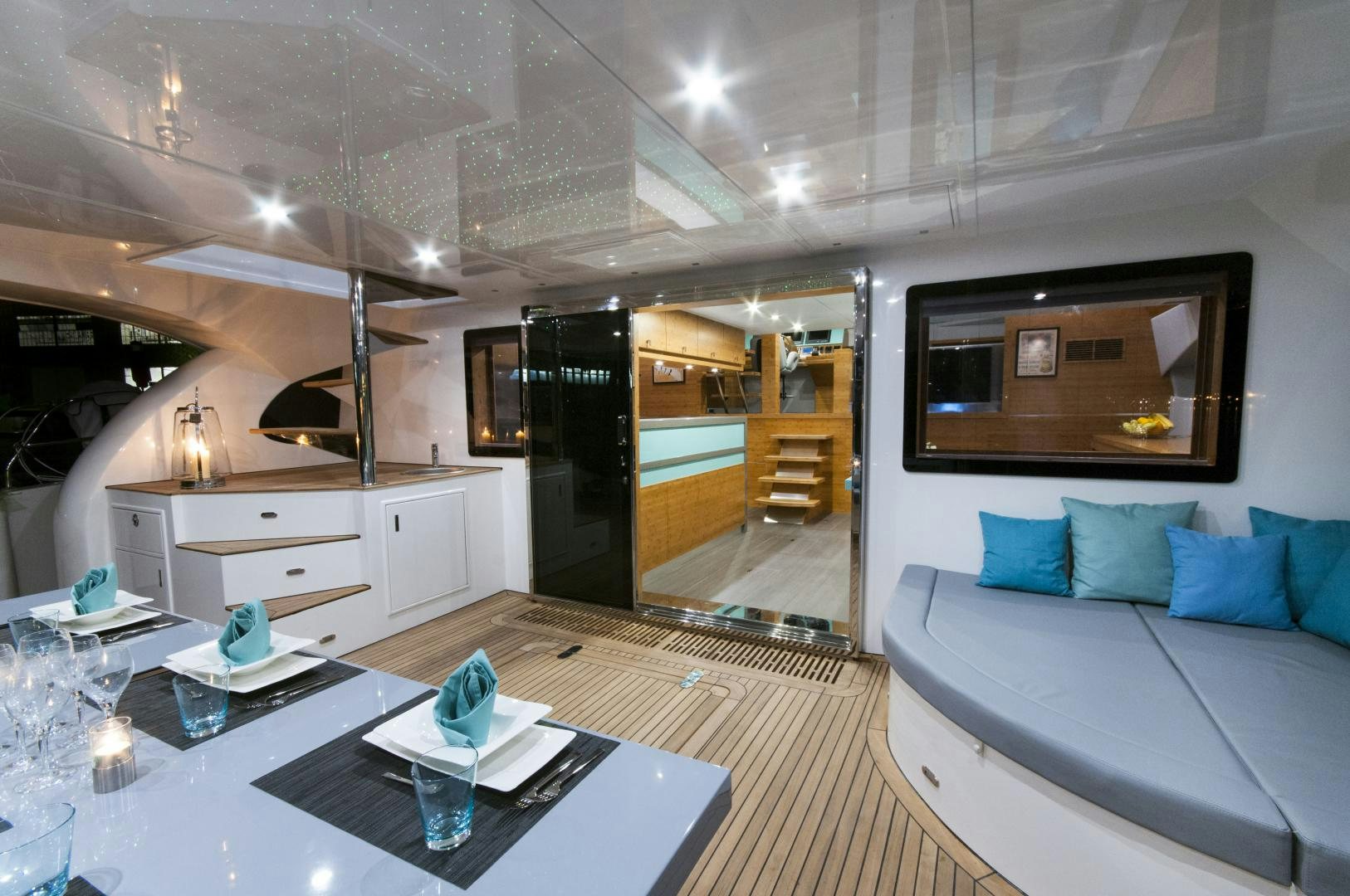 a room with a table and a couch aboard SKYLARK Yacht for Sale