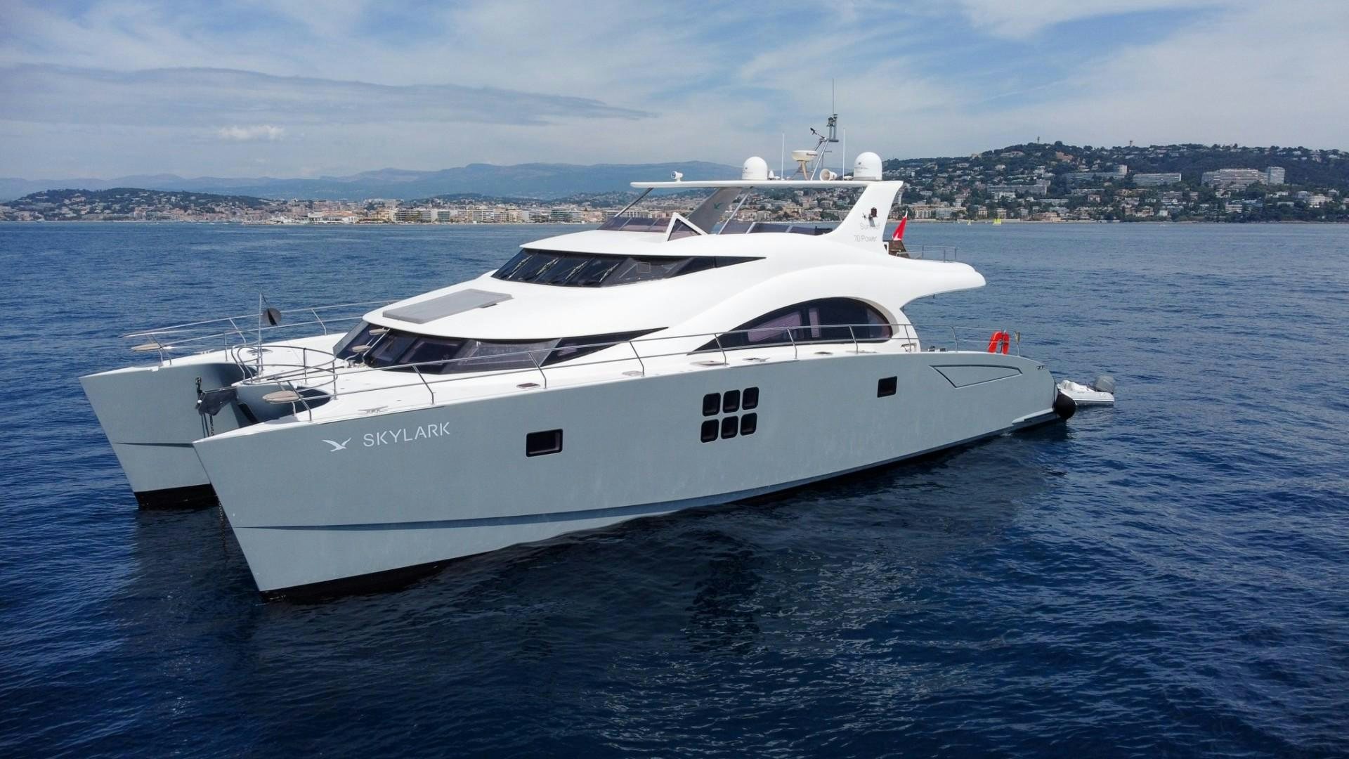 a white yacht in the water aboard SKYLARK Yacht for Sale