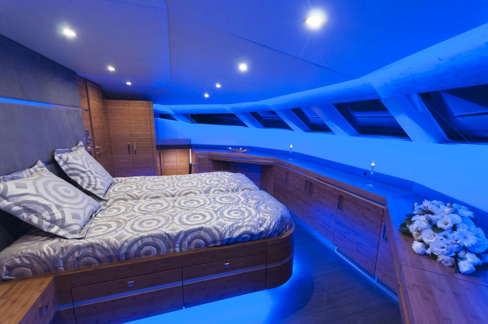 a room with a bed and a window aboard SKYLARK Yacht for Sale