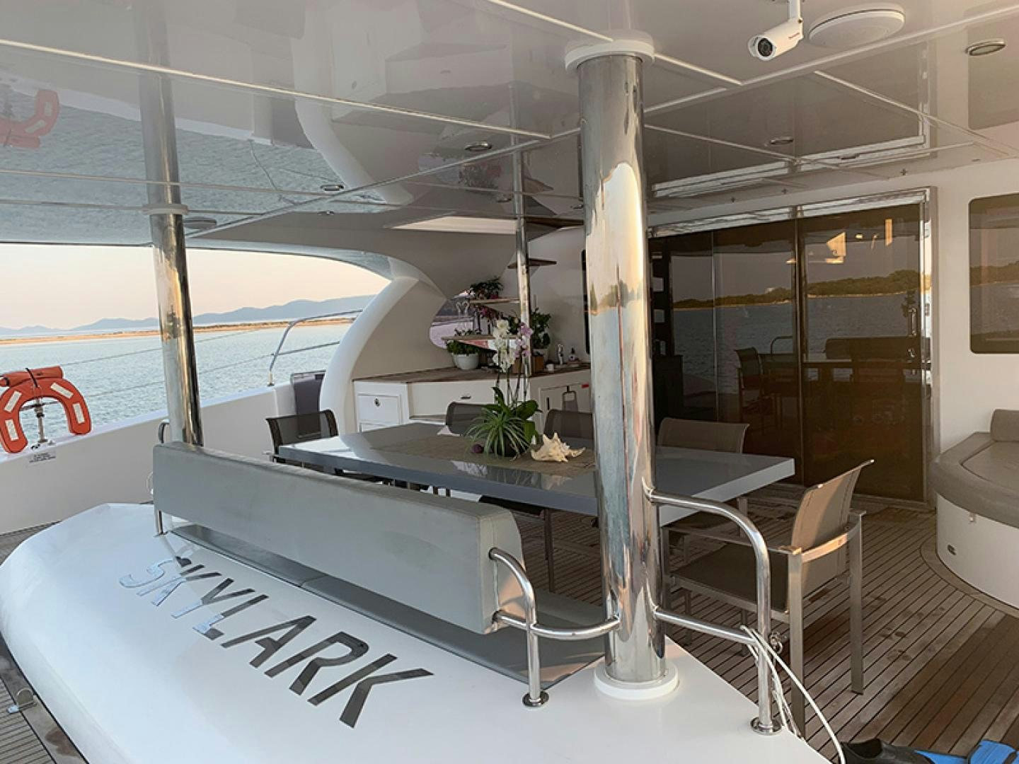 a large room with a table and chairs aboard SKYLARK Yacht for Sale