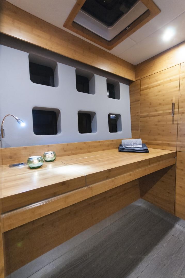 a room with a table and a tv on the wall aboard SKYLARK Yacht for Sale