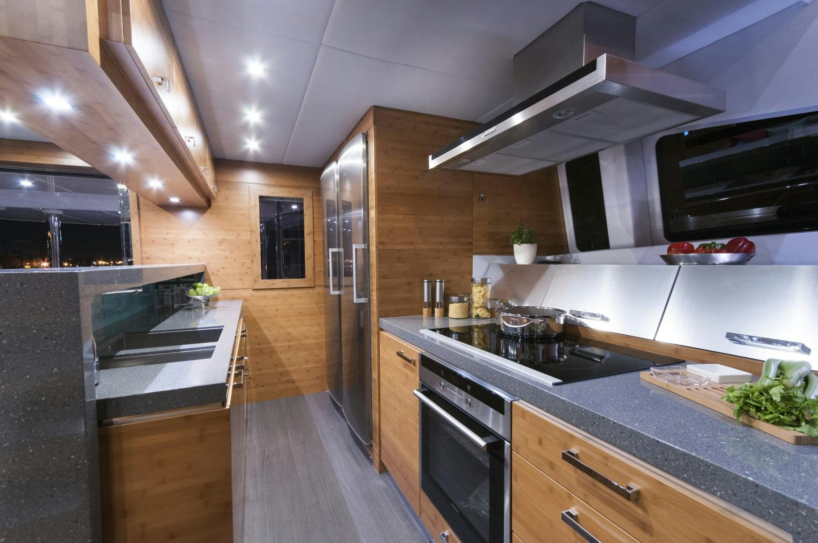 a kitchen with wooden cabinets aboard SKYLARK Yacht for Sale