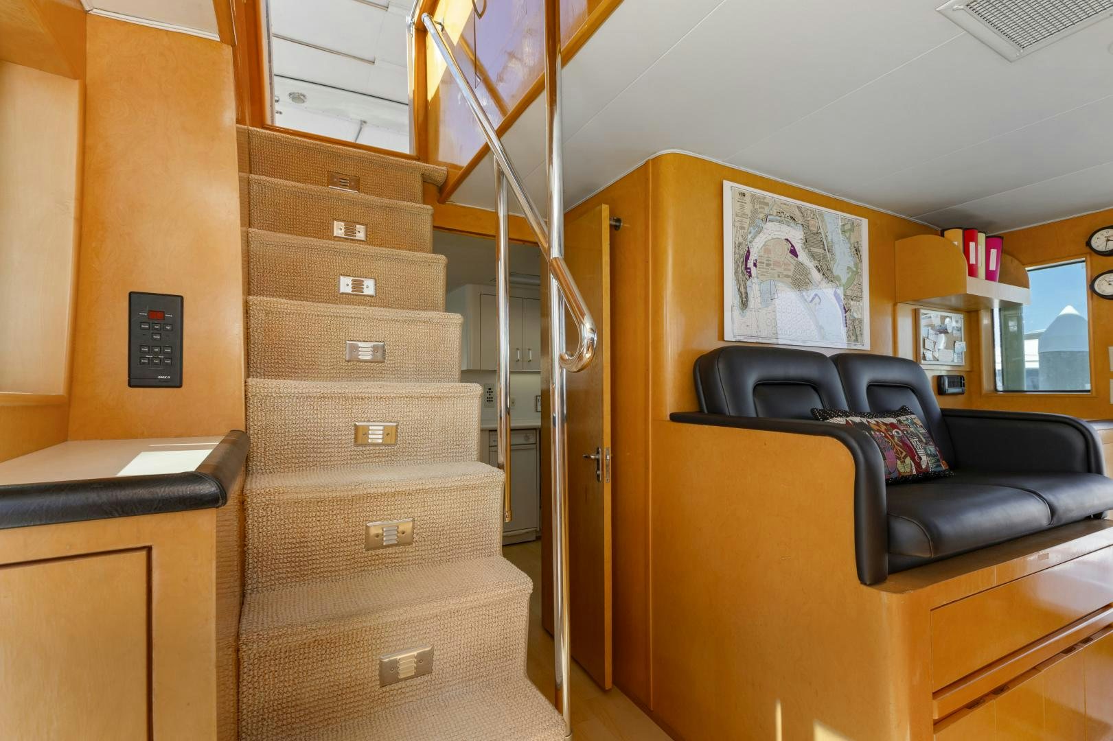 a room with a couch and a ladder aboard DAYDREAMER IV Yacht for Sale