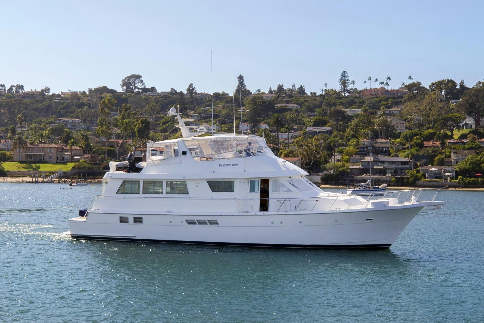 a white boat on the water aboard DAYDREAMER IV Yacht for Sale