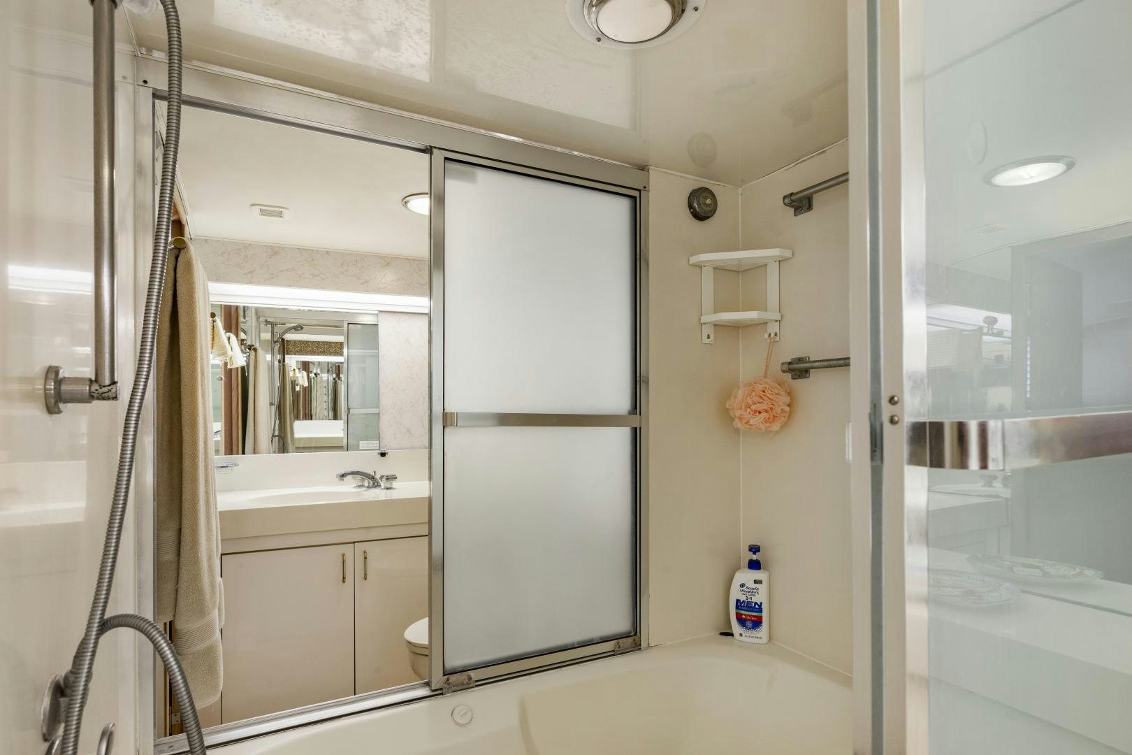 a bathroom with a shower unit aboard DAYDREAMER IV Yacht for Sale