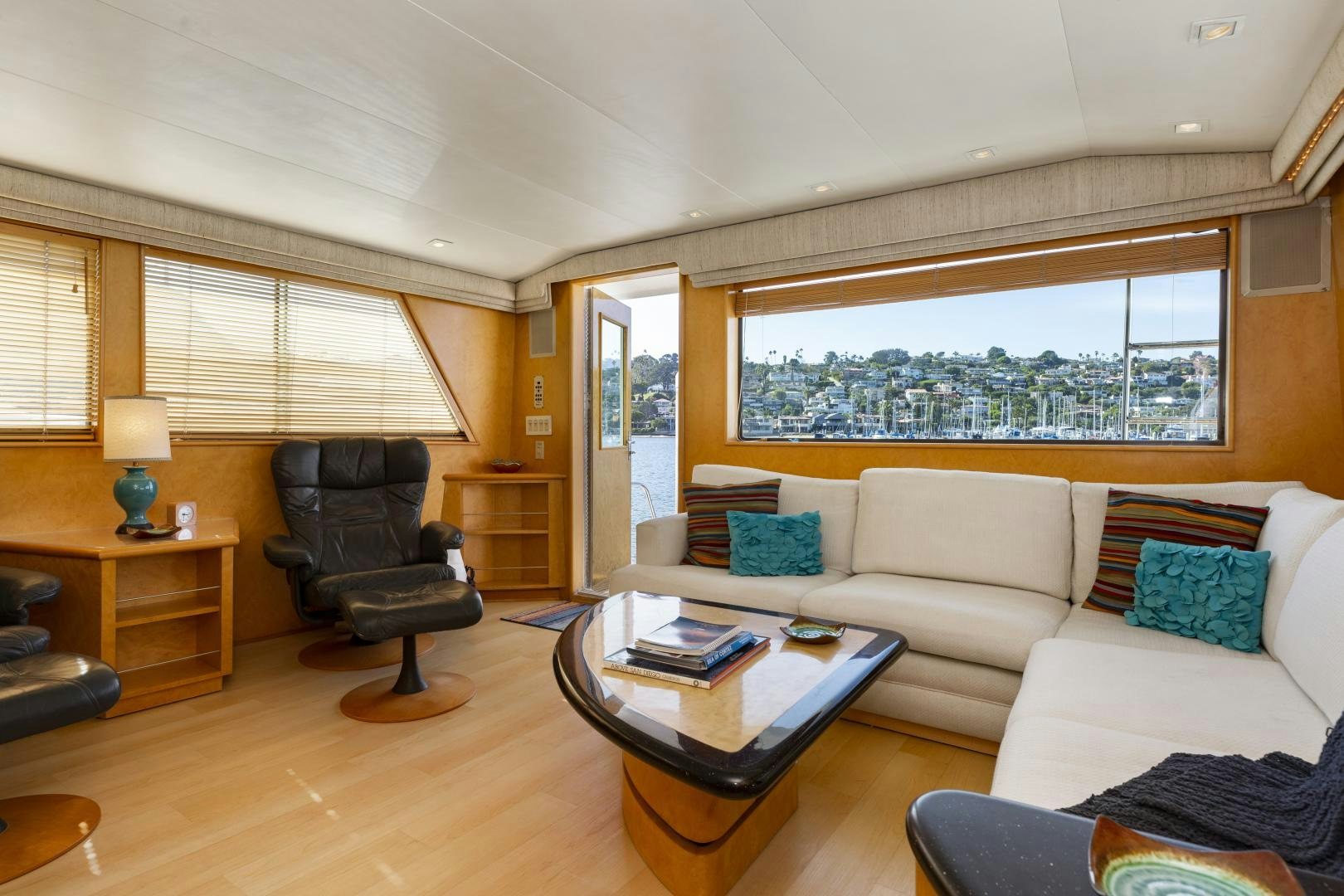 a living room with a couch and a table aboard DAYDREAMER IV Yacht for Sale