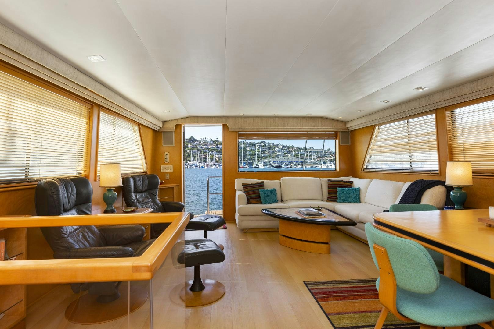 a living room with a couch and a table aboard DAYDREAMER IV Yacht for Sale