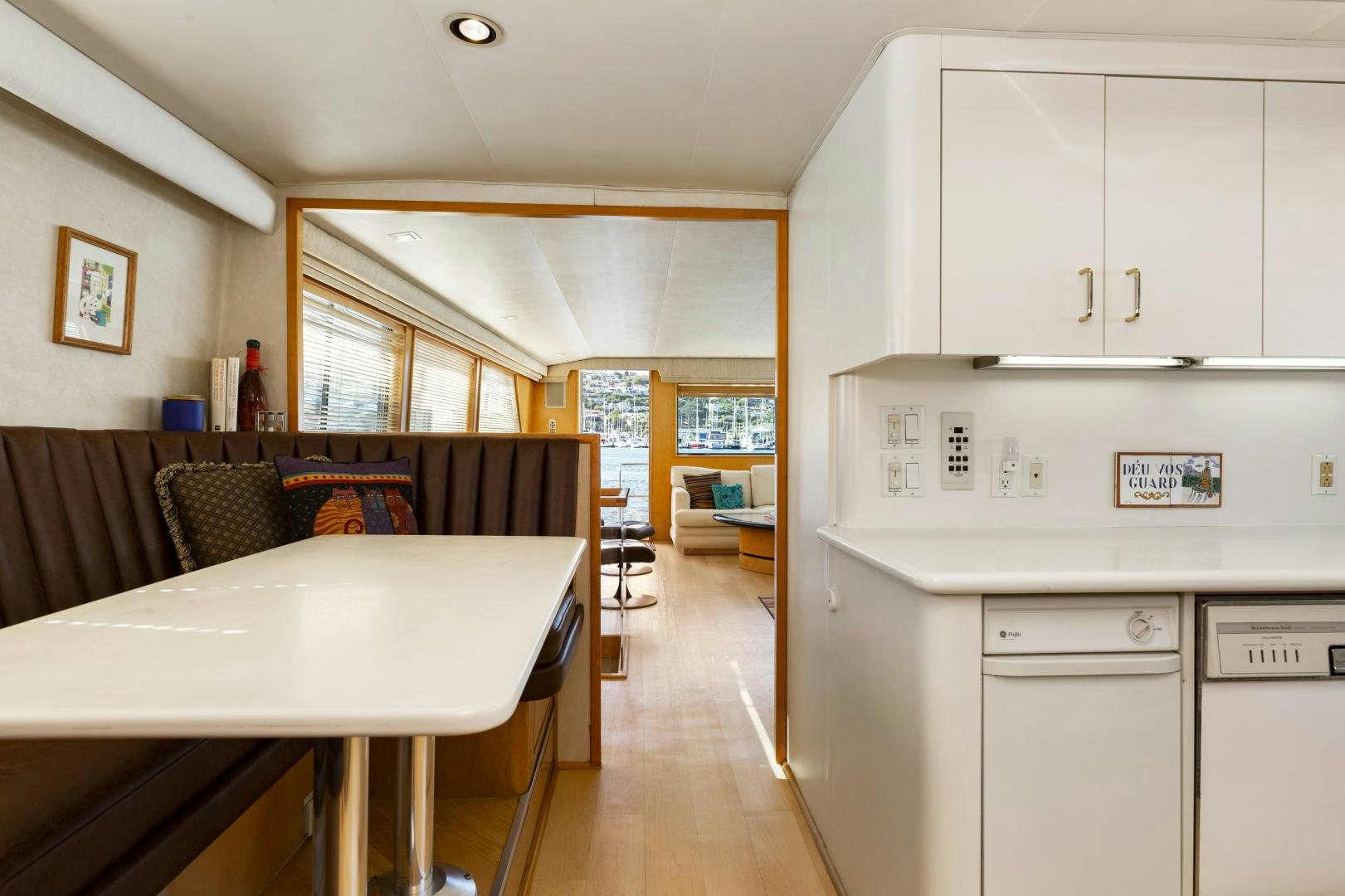 a kitchen with white cabinets aboard DAYDREAMER IV Yacht for Sale