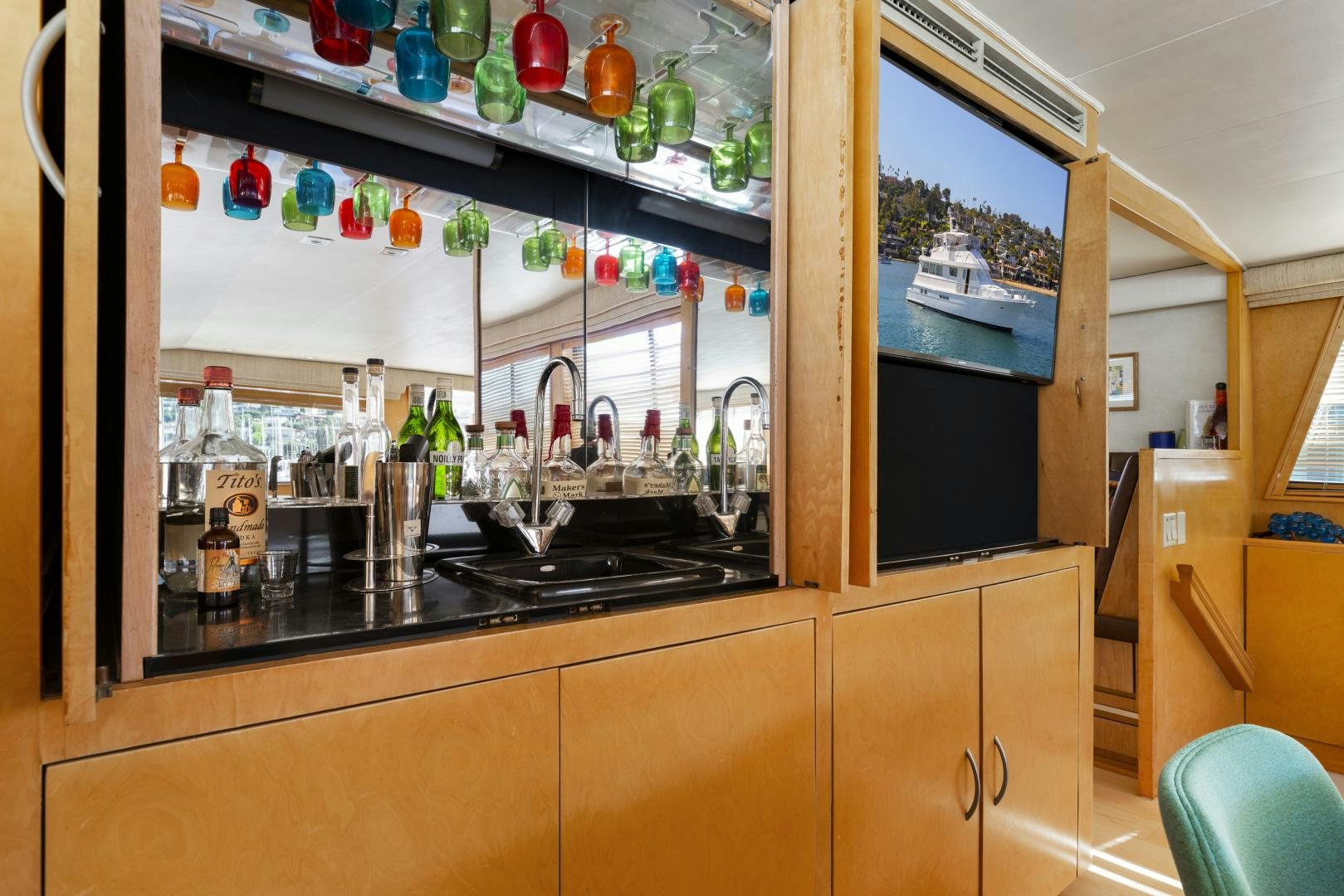 a kitchen with a glass door aboard DAYDREAMER IV Yacht for Sale