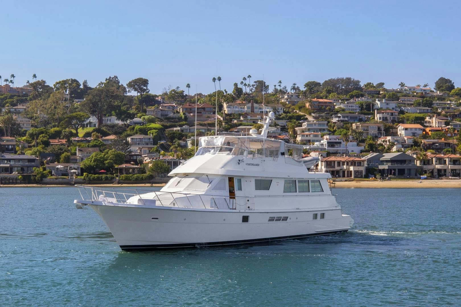 a white yacht in the water aboard DAYDREAMER IV Yacht for Sale