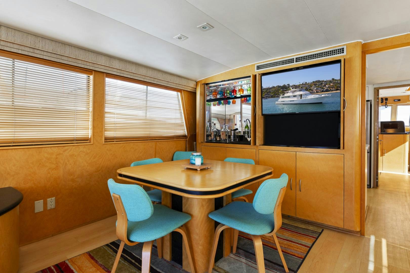 a table and chairs in a room aboard DAYDREAMER IV Yacht for Sale