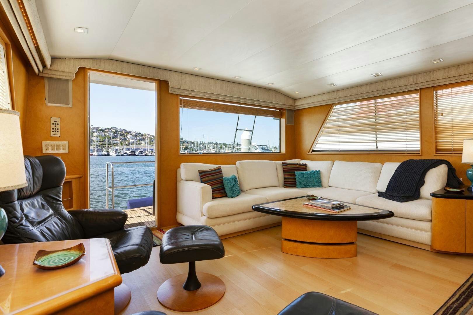 a living room with a couch and a coffee table aboard DAYDREAMER IV Yacht for Sale