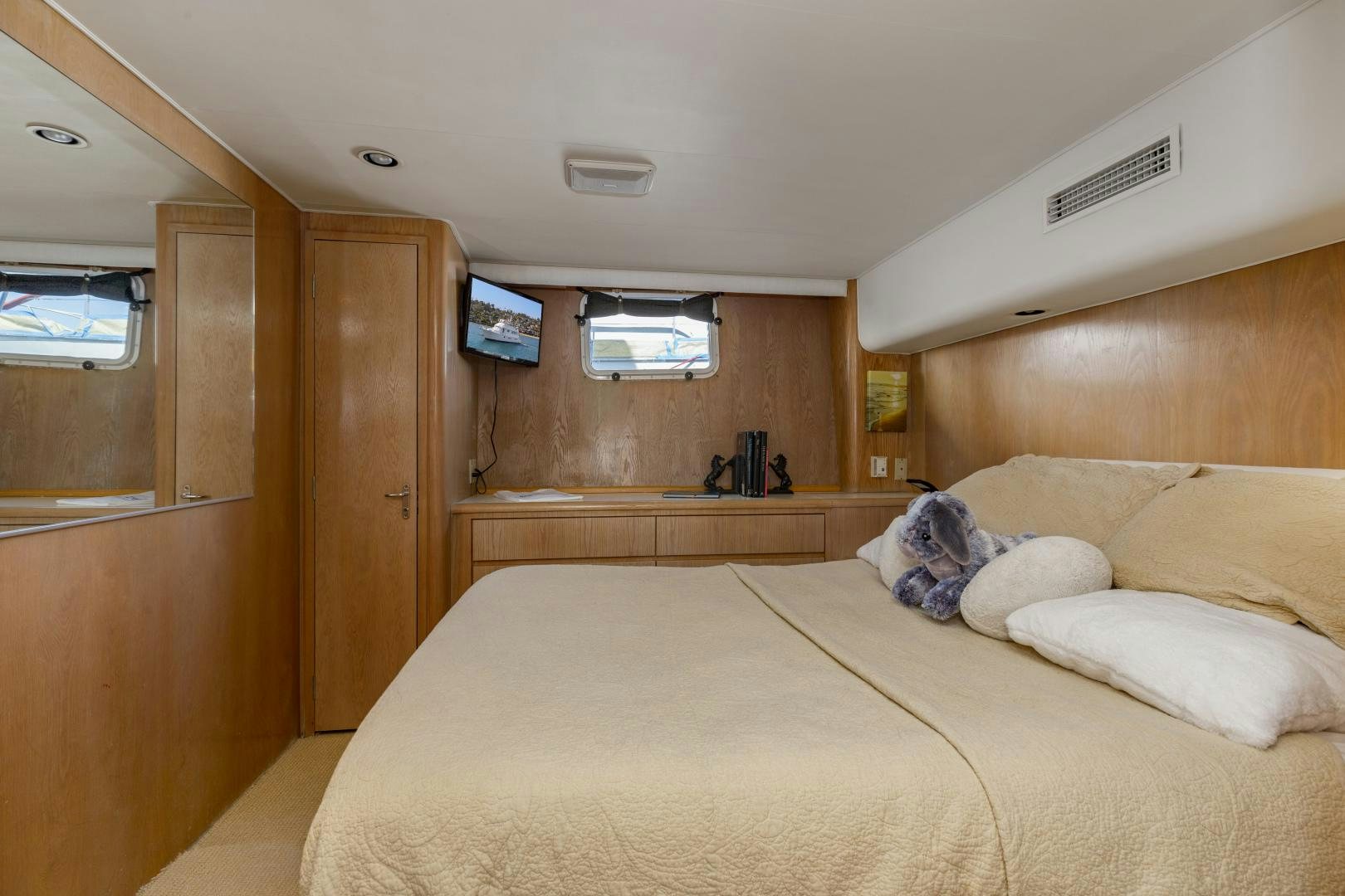 a person lying on a bed aboard DAYDREAMER IV Yacht for Sale
