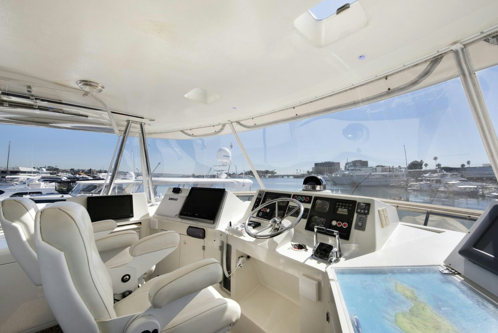a boat with many seats aboard LEGACY Yacht for Sale