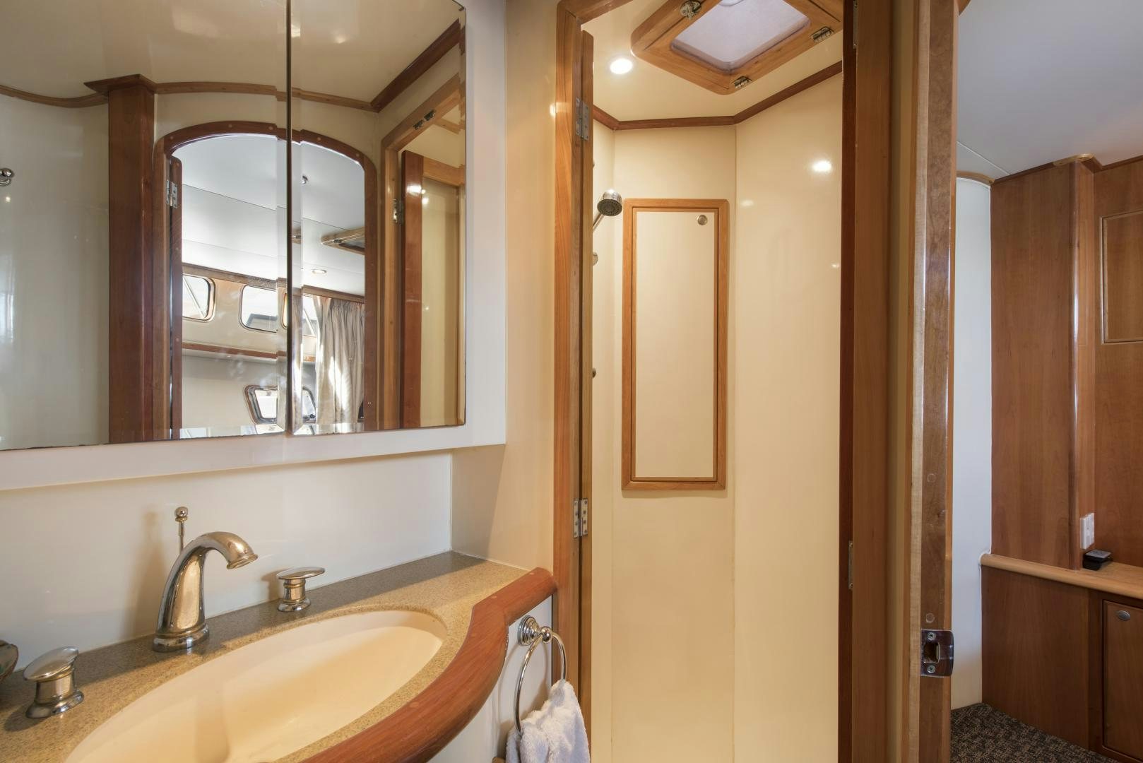 a bathroom with a large mirror aboard LEGACY Yacht for Sale