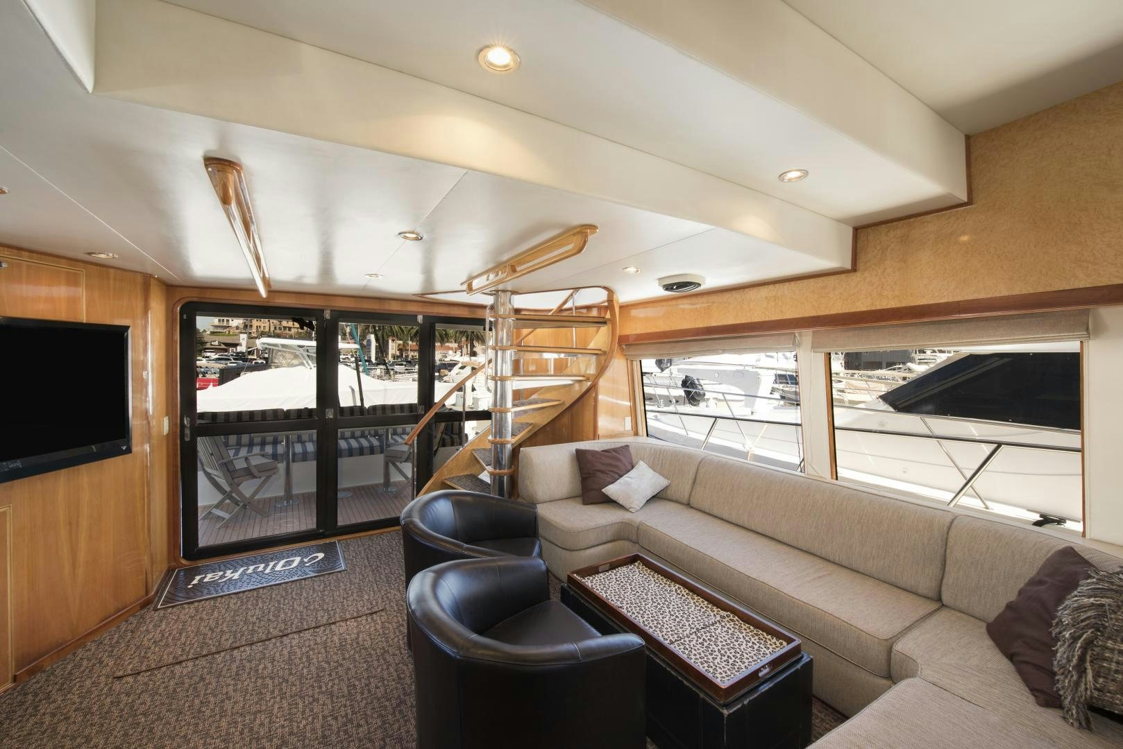 a living room with a large window aboard LEGACY Yacht for Sale