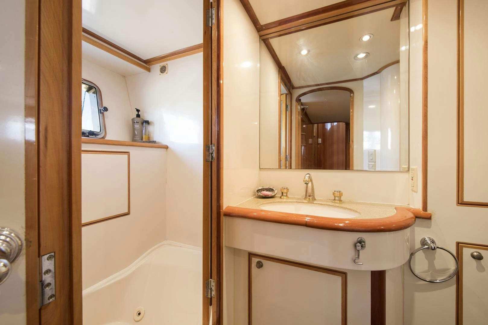 a bathroom with a sink and a mirror aboard LEGACY Yacht for Sale